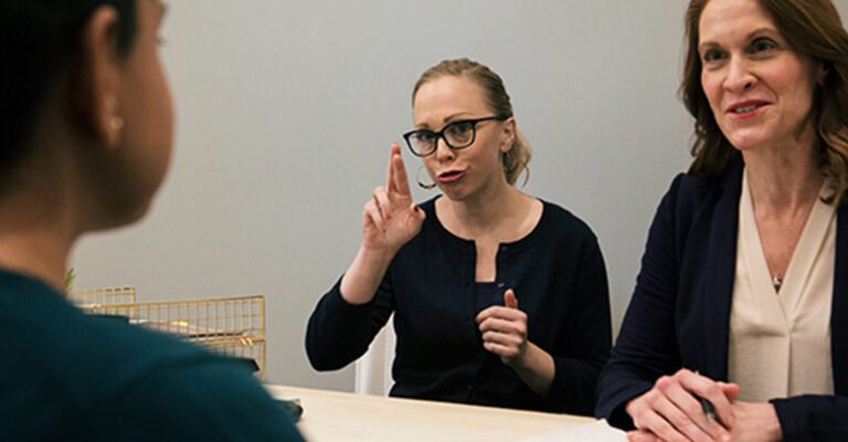 ASL Sign Language Interpreter Facilitating Communication in a Professional Meeting
